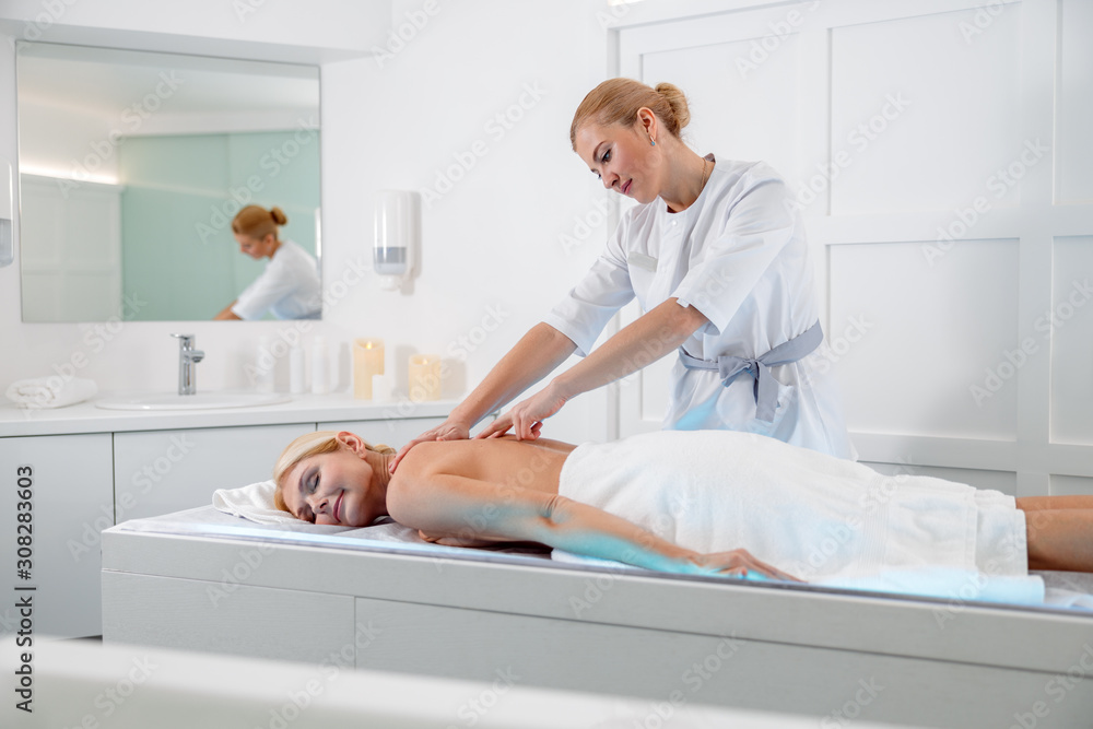 Attractive adult female relaxing in beauty spa Attractive adult female relaxing in beauty spa