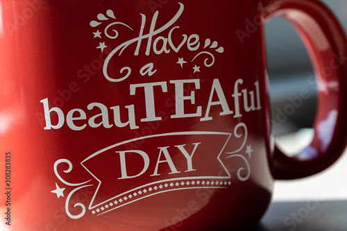 Red cup of tea with a text