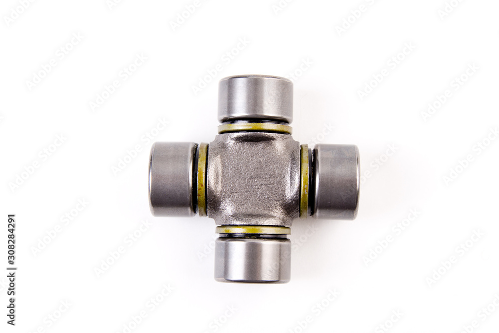 The crossbar of the steering shaft,The propeller shaft yoke for cars isolated on white background. New car parts. The crossbar of the steering shaft,The propeller shaft yoke for cars isolated on white background. New car parts.