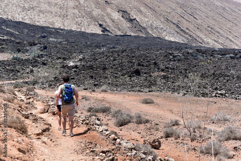 Tourists visiting the Timanfaya National Park, Fire Mountains, volcanic landscape, Lanzarote, Canary Islands, Spain