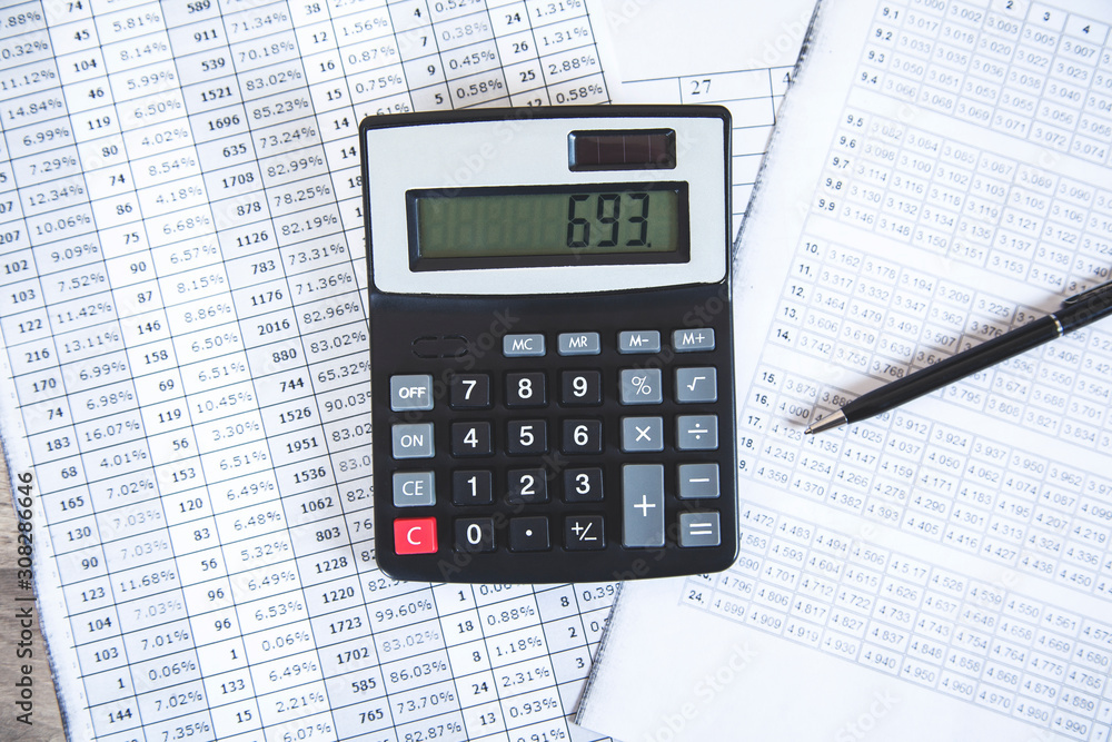 calculator with documents on desk Stock Photo | Adobe Stock