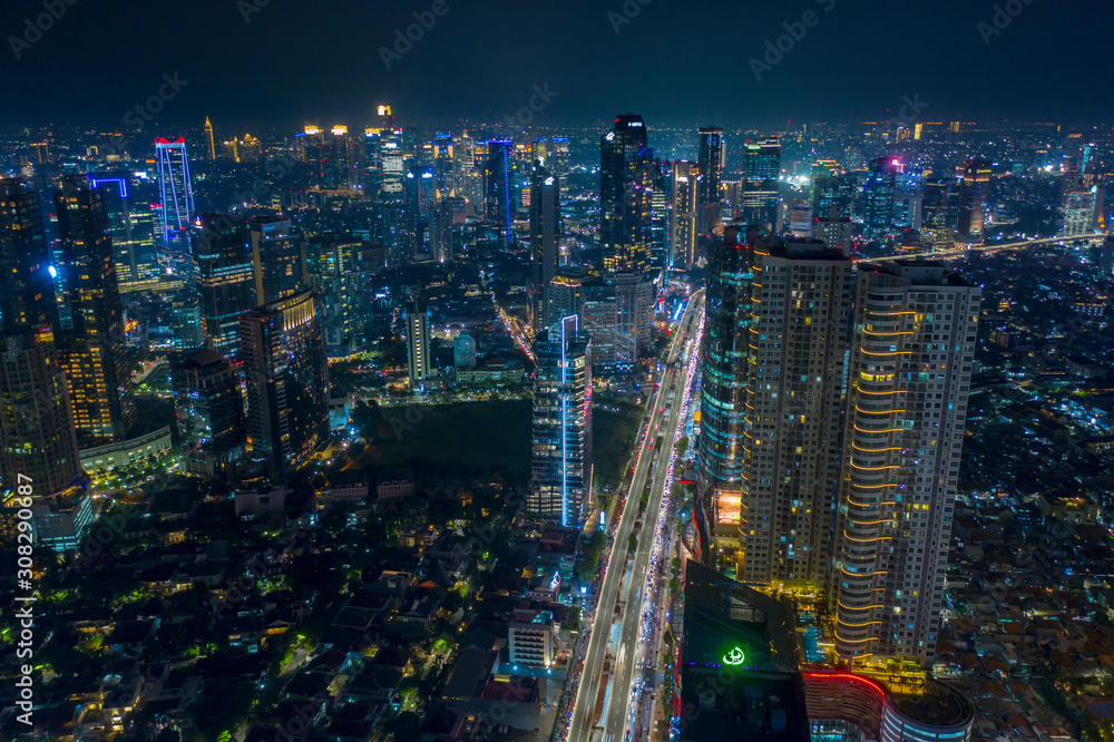 Fototapeta premium Aerial view of skyscrapers and green housing