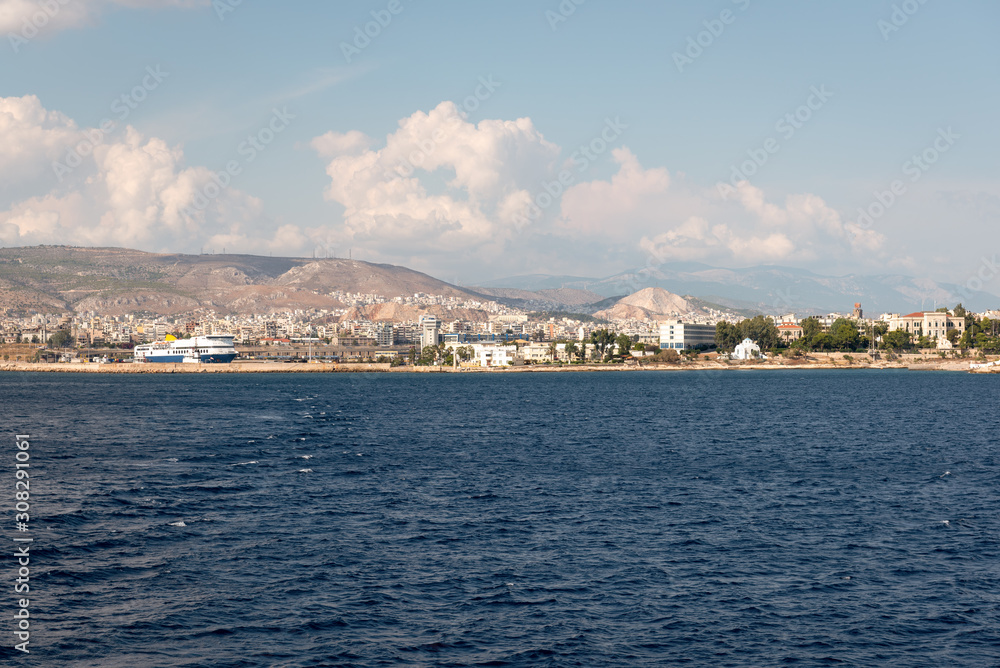 The city of Athens with white houses seen from the sea. Greek coast, Europe