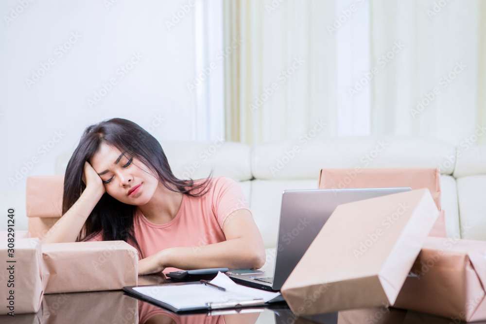 Asian woman feeling dizzy after doing her jobs Asian woman feeling dizzy after doing her jobs