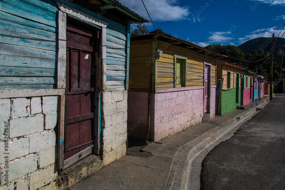 dramatic image of clourful homes on a dominican republic mountain town in the caribbean dramatic image of clourful homes on a dominican republic mountain town in the caribbean