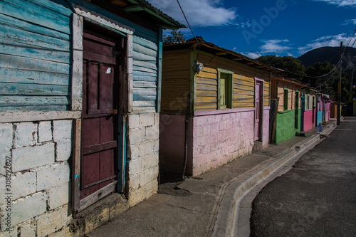dramatic image of clourful homes on a dominican republic mountain town in the caribbean © Todd