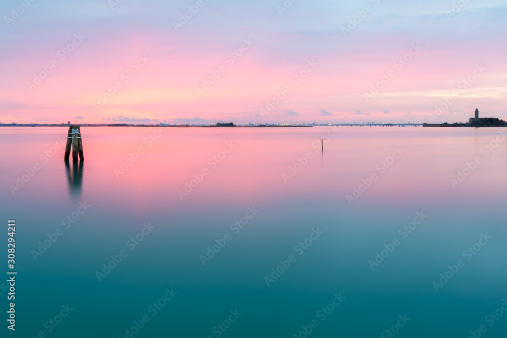 Peaceful sunset on the lagoon of Venice and Burano