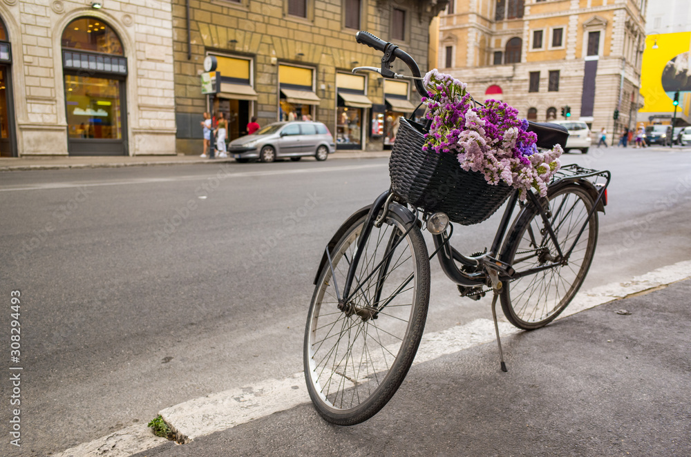 Bicycle with flowers on an street in Rome.