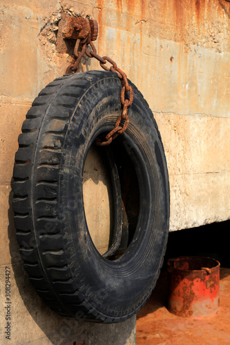 tires are hung on the concrete facade
