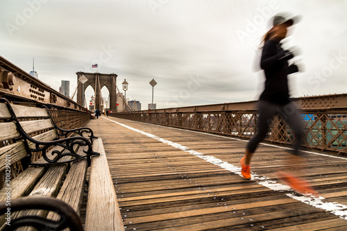 A fit woman running on Brooklyn bridge