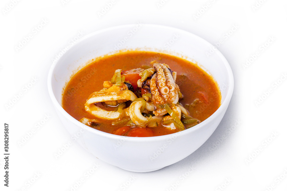 soup with octopus in a plate on a white background soup with octopus in a plate on a white background