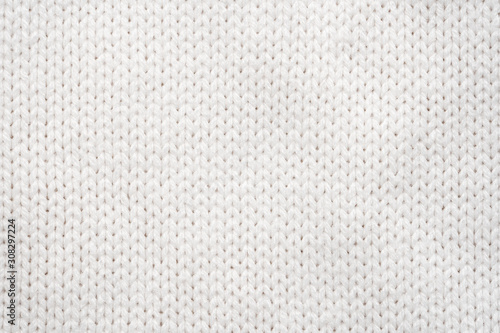 White Knit Fabric Background. Wool Sweater Texture Close Up