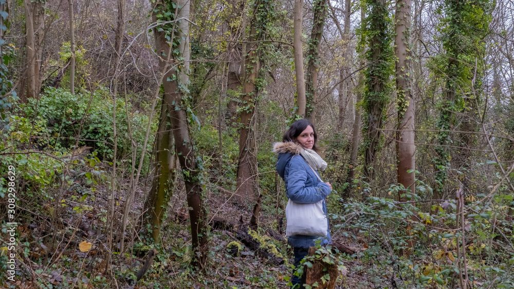 Girl walking in a forest at fall Girl walking in a forest at fall