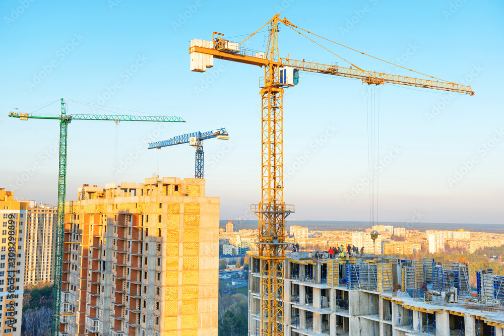 Fototapeta premium Construction with cranes on industrial building site
