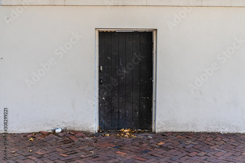 old wooden door in the wall