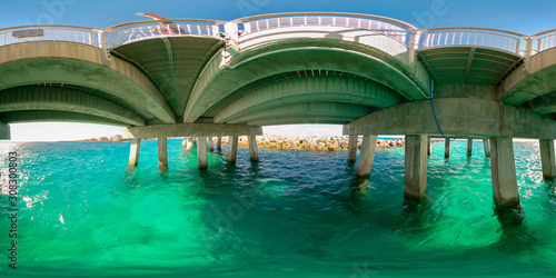 360 spherical photo under a concrete fishing pier Miami Beach view of water