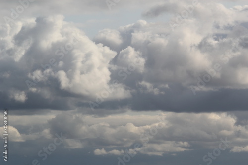 Fototapeta Naklejka Na Ścianę i Meble -  Fluffy clouds on the blue sky in the evening