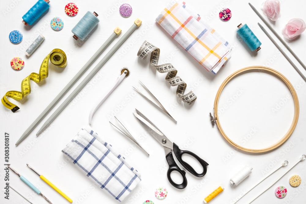 Sewing flat lay top view Composition with threads and sewing accessories on wnite background, flat lay banner Sewing flat lay top view Composition with threads and sewing accessories on wnite background, flat lay banner