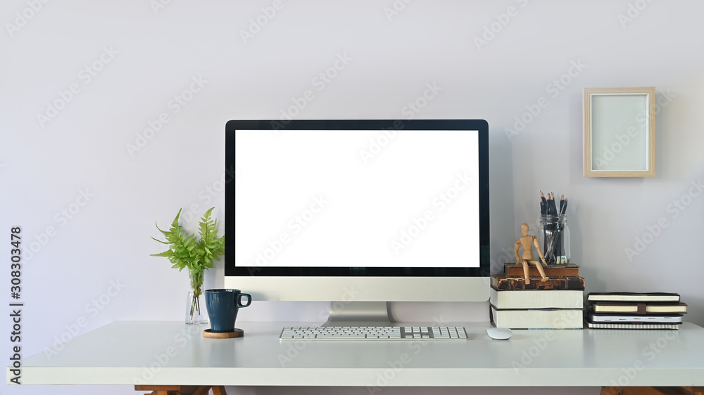 Workspace computer empty screen and office supply on white table. Workspace computer empty screen and office supply on white table.