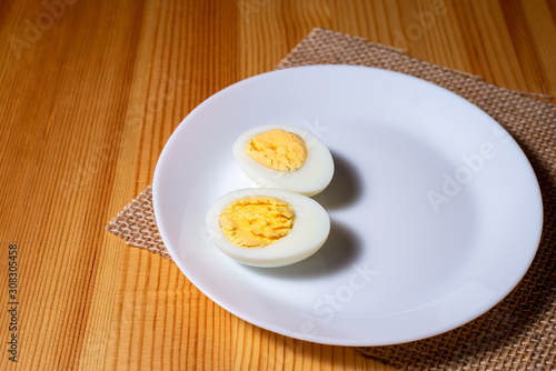 boiled egg in a plate on a wooden table