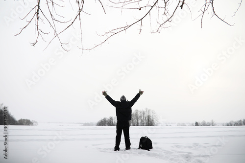 A man on a walk. Winter landscape. Tourist in winter journey. © alexkich