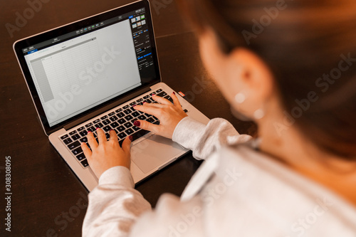 Girl using computer at work photo