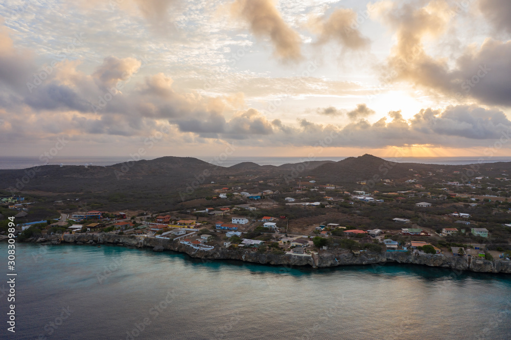 Aerial sunrise view of coast of Curaçao in the Caribbean Sea with turquoise water and cliff around Westpunt