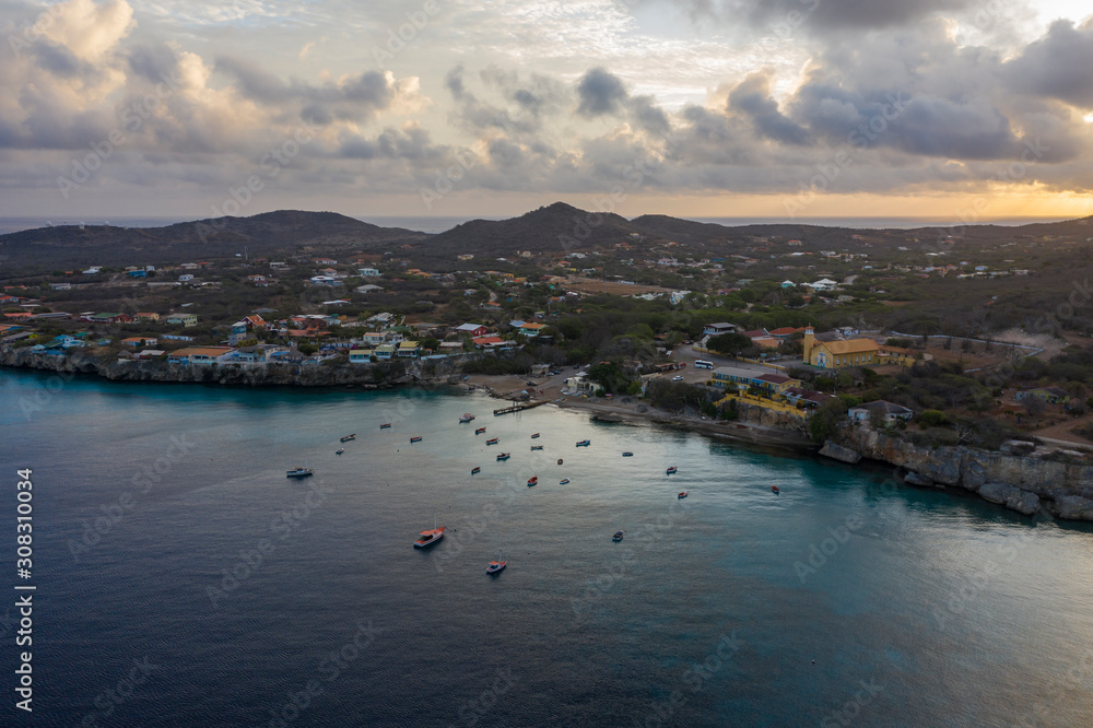 Aerial sunrise view of coast of Curaçao in the Caribbean Sea with turquoise water and cliff around Westpunt