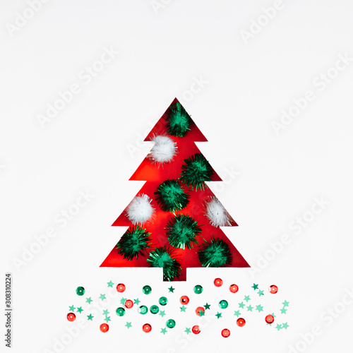 Christmas holiday composition. Xmas tree made of decorations on white background. Christmas, New Year, winter minimal concept. Flat lay, top view, copy space