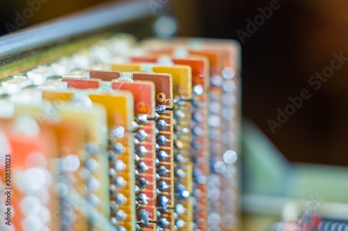 Vintage electronic circuit boards with radio parts and chips, close-up, macro photo