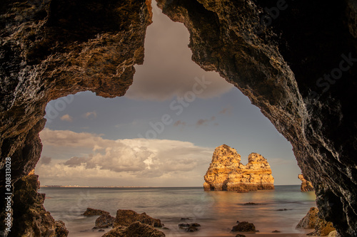 View from a cave. Praia do camilo, Algarve, Portugal. Travel concept