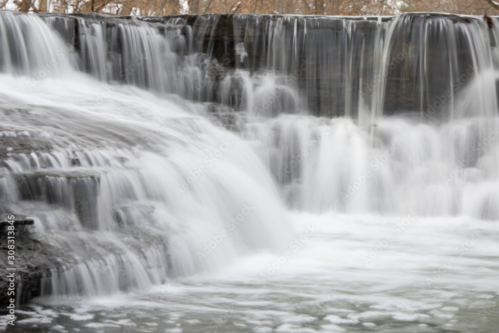 Small steps on a winter river waterfall Small steps on a winter river waterfall