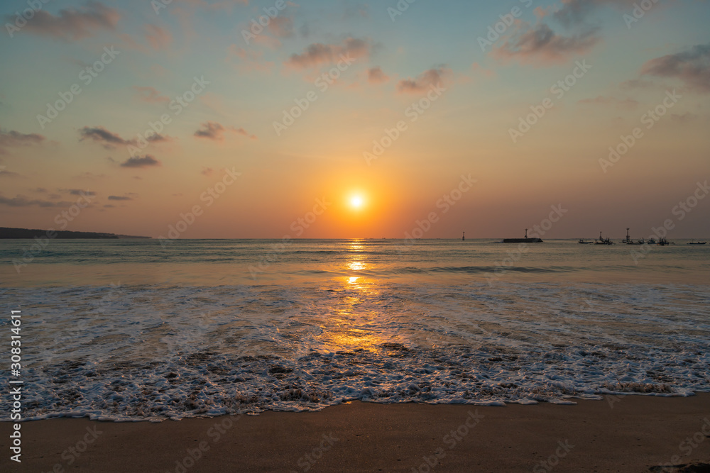 Beautiful sunset scenery at Jimbaran beach, Bali island, Indonesia.