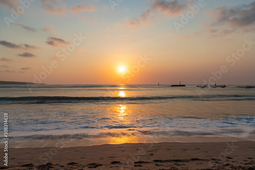 Beautiful sunset scenery at Jimbaran beach, Bali island, Indonesia.