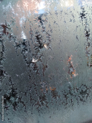 Frosty patterns on glass, Abstract texture background, Winter © Taras