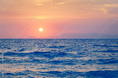 Sunset over sea. Dusk. photo