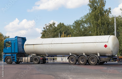 A gas tanker on a city highway