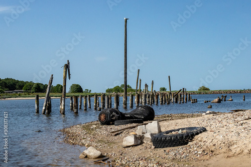  boat details on the beach and old rubber tire