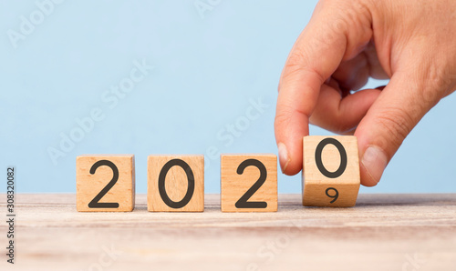  New Year's Concept.Hand Change Date From 2019 To 2020 On Wooden Cube Calendar.
