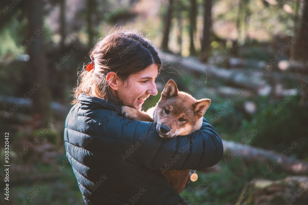 Walk in the forest with his puppy, autumn colours Walk in the forest with his puppy, autumn colours