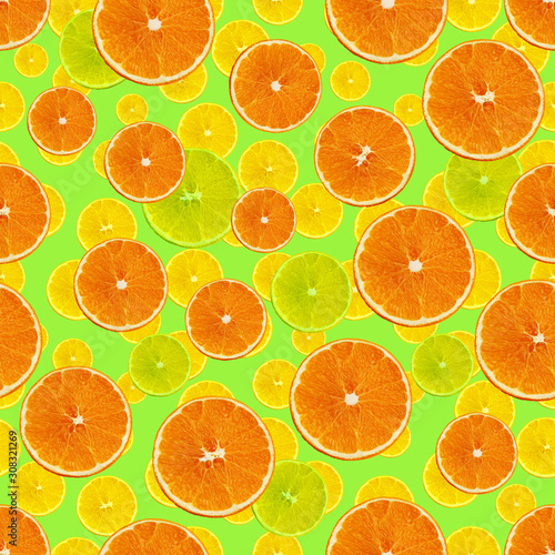 set seamless texture with juicy slices of orange, lemon, lime on a green background for a menu or recipe, concept of vegetarian, vitamin and wholesome food, background, pattern for textile, wallpaper