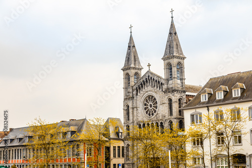 Street with church of the Redemptorists of Tournai, Walloon municipality, Belgium photo