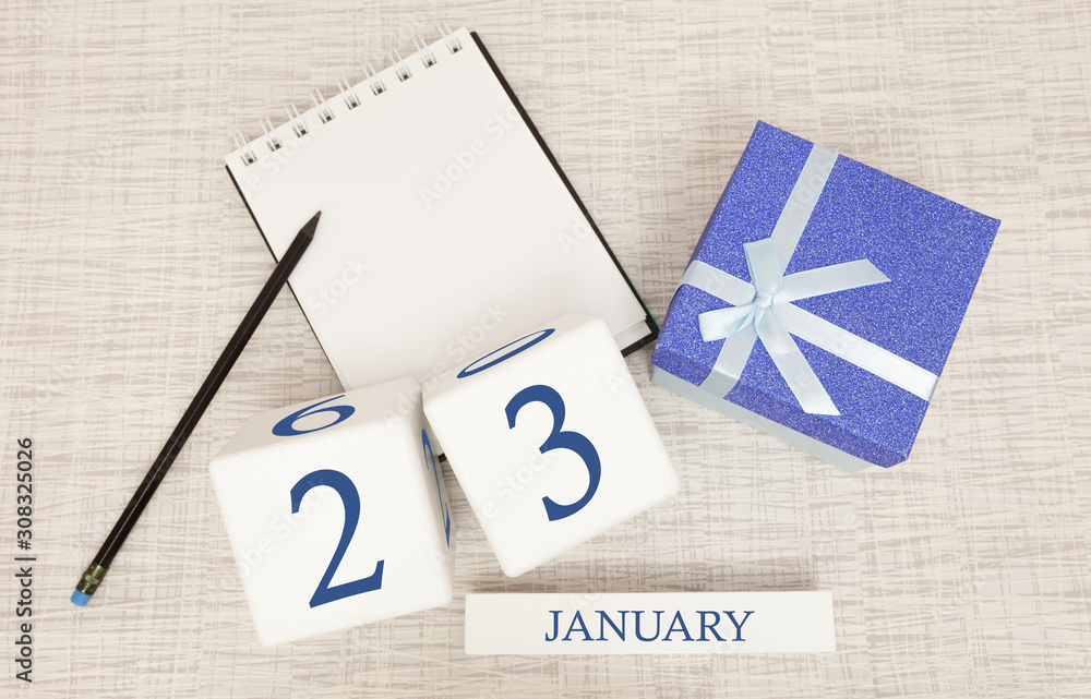 Calendar with trendy blue text and numbers for January 23 and a gift in a box.
