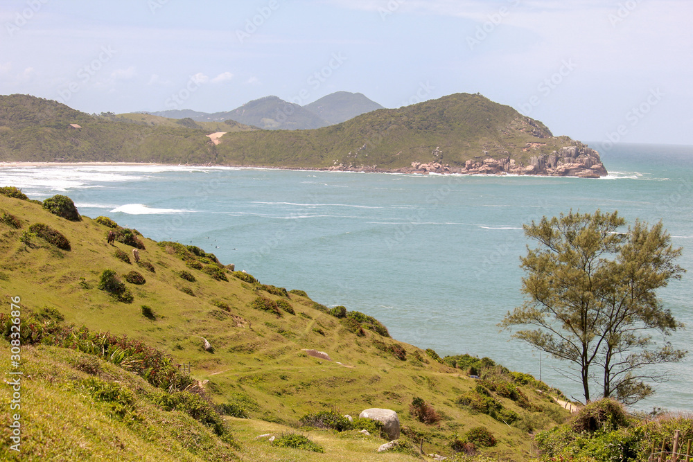 Landscape of the beach seen by the trail from Praia do Luz to Praia do Rosa Landscape of the beach seen by the trail from Praia do Luz to Praia do Rosa