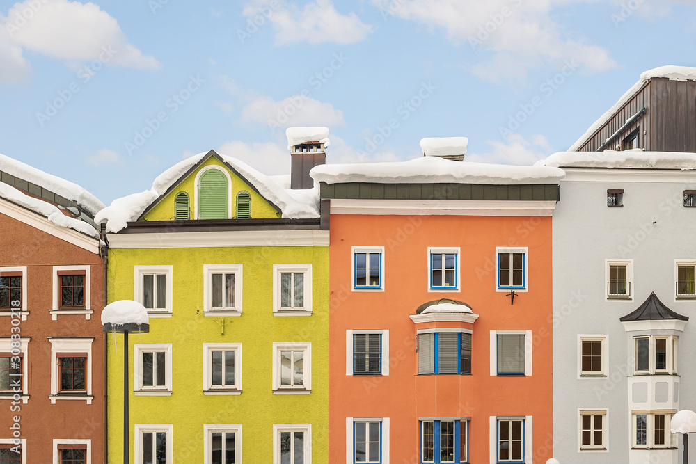 Bright multicolored facades of old medieval buildings in historical center of famous alpine austrian town Kufstein in Austria Europe. Colorful houses in small european city center with blue clear