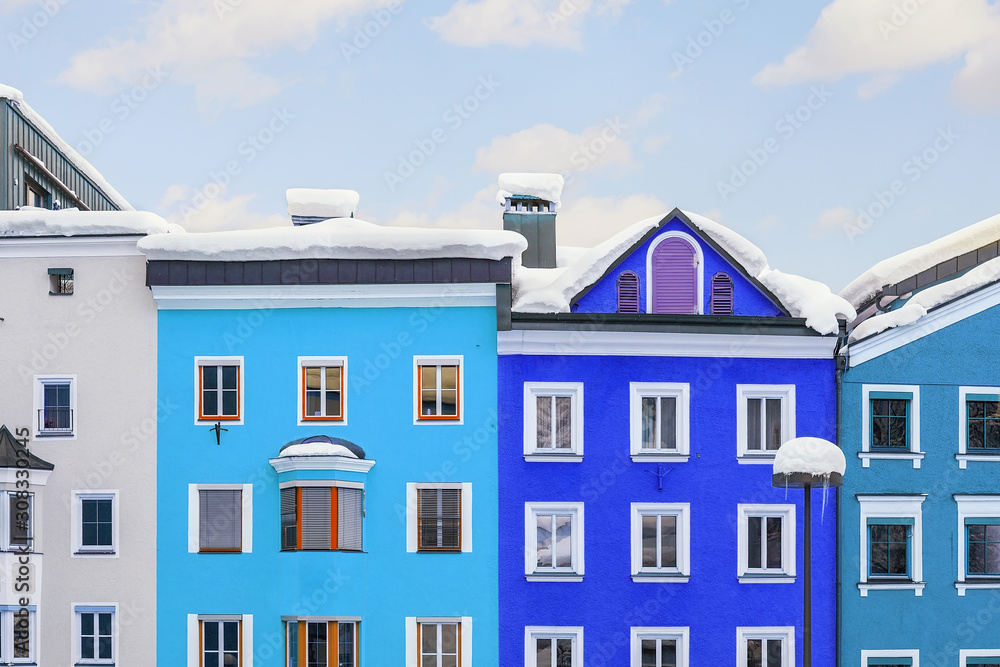 Bright multicolored facades of old medieval buildings in historical center of famous alpine austrian town Kufstein in Austria Europe. Colorful houses in small european city center with blue clear