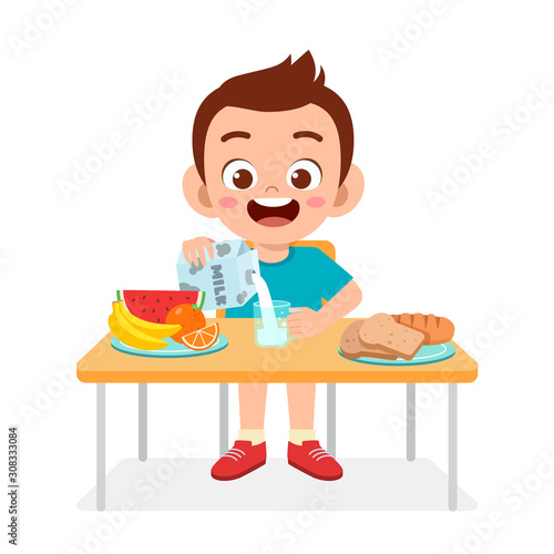 happy cute kid boy eat healthy food