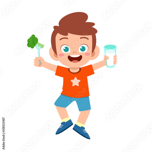 happy cute kid boy drink fresh milk