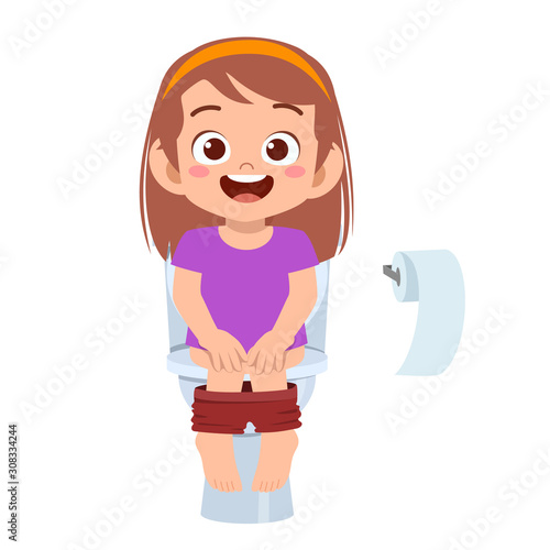 happy cute kid girl sit on the toilet