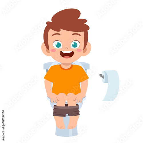 happy cute kid boy sit on the toilet